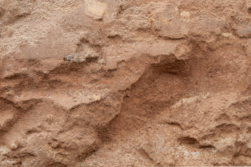 でこぼこした土壁 ざらざらした土の表面 背景