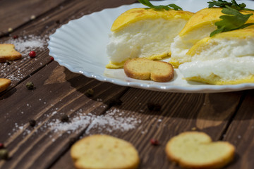 unusual omelet. egg tart. Cook at home. Gourmet breakfast in a French cafe. scrambled eggs, crackers, greens.