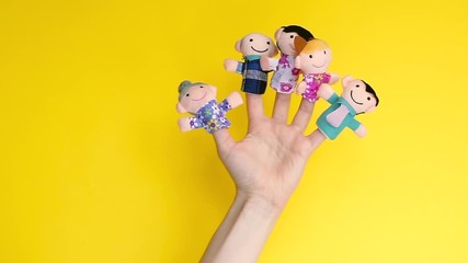 family finger puppet theater. hand with finger puppets: son, daughter,mum, dad, granny, granddad. Kid playing fingers puppets. Family and generation concept. social distancing