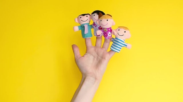 family finger puppet theater. female hand with finger puppets: son, daughter, mum, dad. parents playing with kid finger puppet. Family generation together. quarantine fun. social distancing