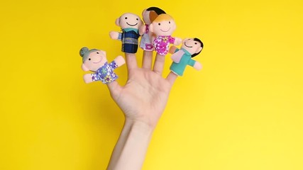 Puppet theater. Hand wearing finger family members puppets: mum, dad, father, mom, daughter, son. happy family concept.quarantine fun. template mock up.Copy space. social distancing