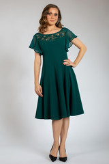 beautiful girl posing in green dress