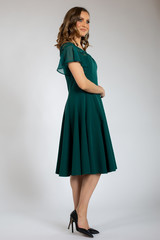 beautiful girl posing in green dress