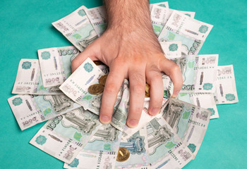 Man holds Russian money. Financial theme. Money in men's hands.