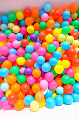Small colorful plastic balls in playground yard