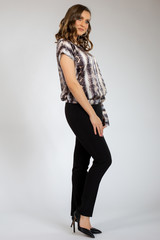 Fototapeta premium beautiful young girl posing in black pants and shirt