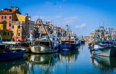 Big fishing boats moored in the port on the Adriatic sea at Chioggia, near Venice in Italy.