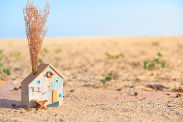 Real estate, lifestyle concept,Miniature house and car on blue sky background