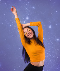 Happy girl on a background of the starry sky. Astrology. Girl and stars. Milky Way