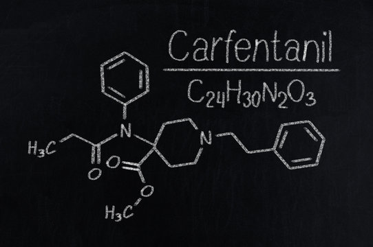 Black chalkboard with the chemical formula of Carfentanil
