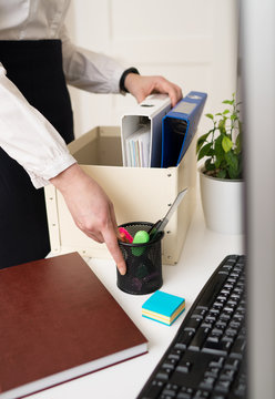 Businesswoman Holding Cardboard Box With Office Stuff. Resignation Concept.