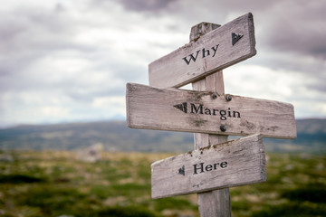 why margin here text engraved on wooden signpost outdoors in nature.