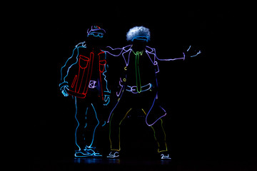 Back to the future light show. Neon glow dancers. Entertainment.