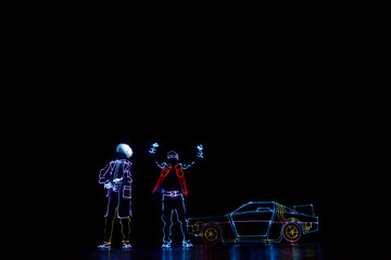Back to the future light show. Neon glow dancers. Entertainment.