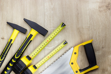 Woodworking tools on wood background