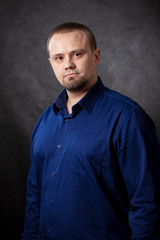 Fototapeta premium a young man businessman on a plain background.