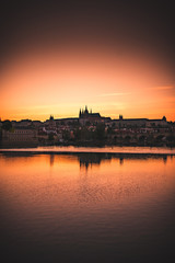 Sunset over Prague castle and Vltava river