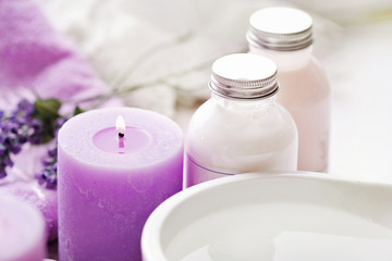 Obraz na płótnie Canvas SPA products with essential oils and lavender flowers