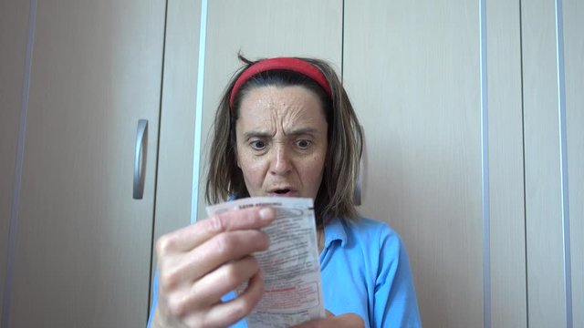 Fethiye, Turkey - 15th of May 2020: 4K Woman is outrage seeing a bill
