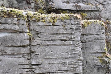 old stone wall with moss
