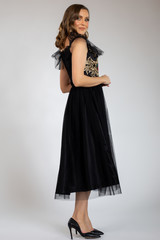 Fototapeta premium beautiful girl posing in back dress