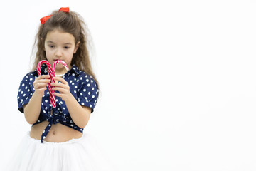 Beauty fashion model girl holding colourful lollipop.