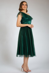 Fototapeta premium Beautiful girl posing in green dress