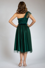 Naklejka premium Beautiful girl posing in green dress