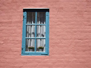 Fototapeta na wymiar Details of a window and painted wall of a traditional style house Denmark