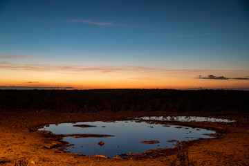 The sun sets at the Moringa Waterhole