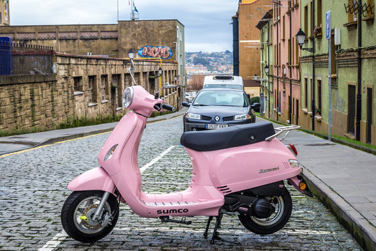 Gijon, Spain - January 25, 2019: Sumco Rommi scooter in historic part of Gijon city in northwestern Spain