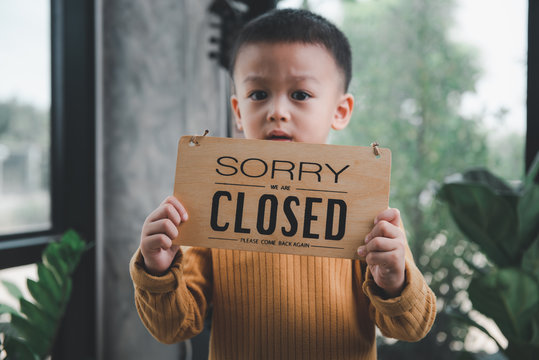 Asian Baby Boys Are Very Cute Handsome And Good Looking, Holding A Sign Showing The Word 