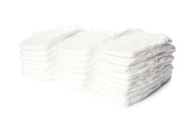 Stacks of baby diapers isolated on white