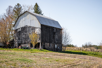 Rural barn in a field on a hill