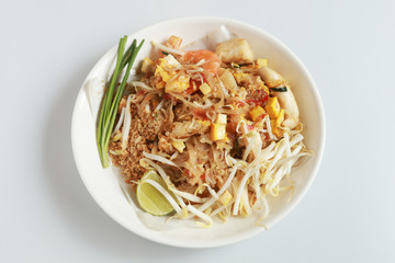 Fried noodle Thai style with prawns Thailand call Pad Thai, Stir-fried noodle Thai style on the wood table.