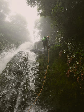man on waterfall