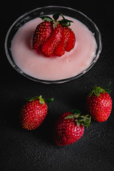 Strawberry pudding on dark background
