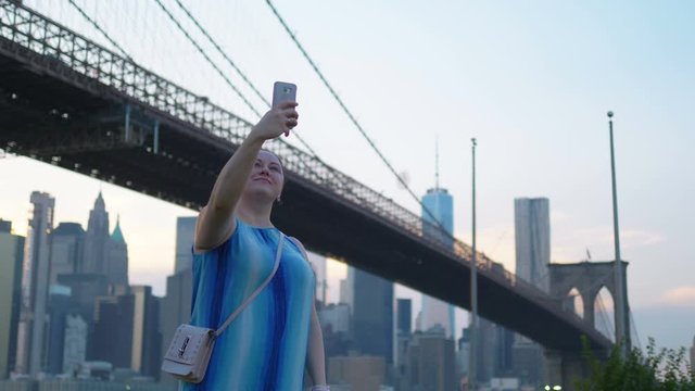 Girl Takes A Selfie on New York City Brooklyn in 4K Slow motion 60fps