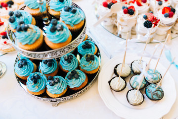 Wonderful bright sweet cupcakes with berries