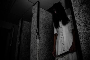 Portrait of asian woman make up ghost face with blood,Horror scene,Scary background,Halloween...