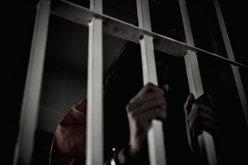 Hands of women desperate to catch the iron prison,prisoner concept,thailand people,Hope to be...