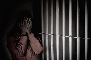 Hands of women desperate to catch the iron prison,prisoner concept,thailand people,Hope to be...