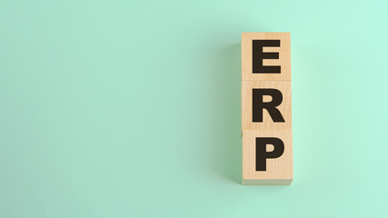 enterprise resource planning ERP acronym lettering on wooden blocks business management concept
