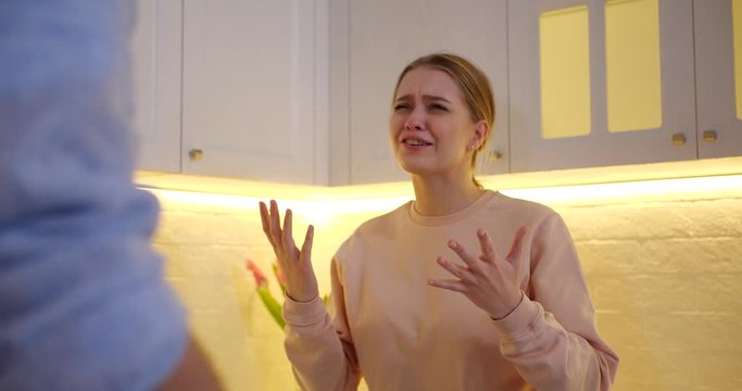 Сouple having argument in kitchen. Relationship problems