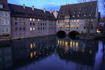 Heilig Geist Spital, a historical hospital on Pegnitz river in old town of Nuremberg, Bavaria,...