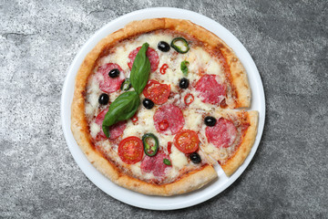 Delicious pizza Diablo on dark background, top view