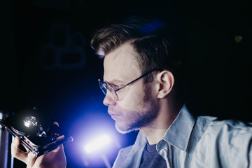  male computer technician holds a hard drive. computer storage drive.