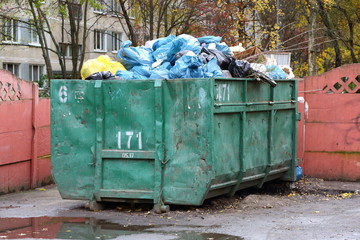 Big dumpster full of garbage