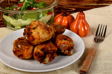 roasted chicken legs with lettuce and peppers