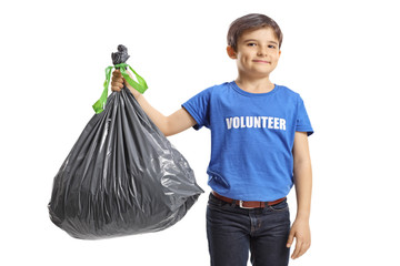 Boy volunteer holding a waste bag